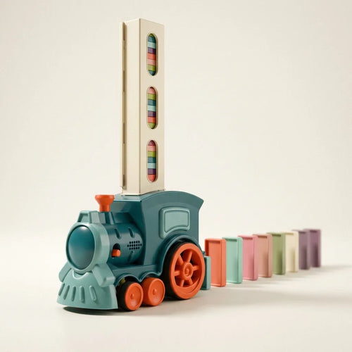 Domino train that lays the dominoes, studio photo