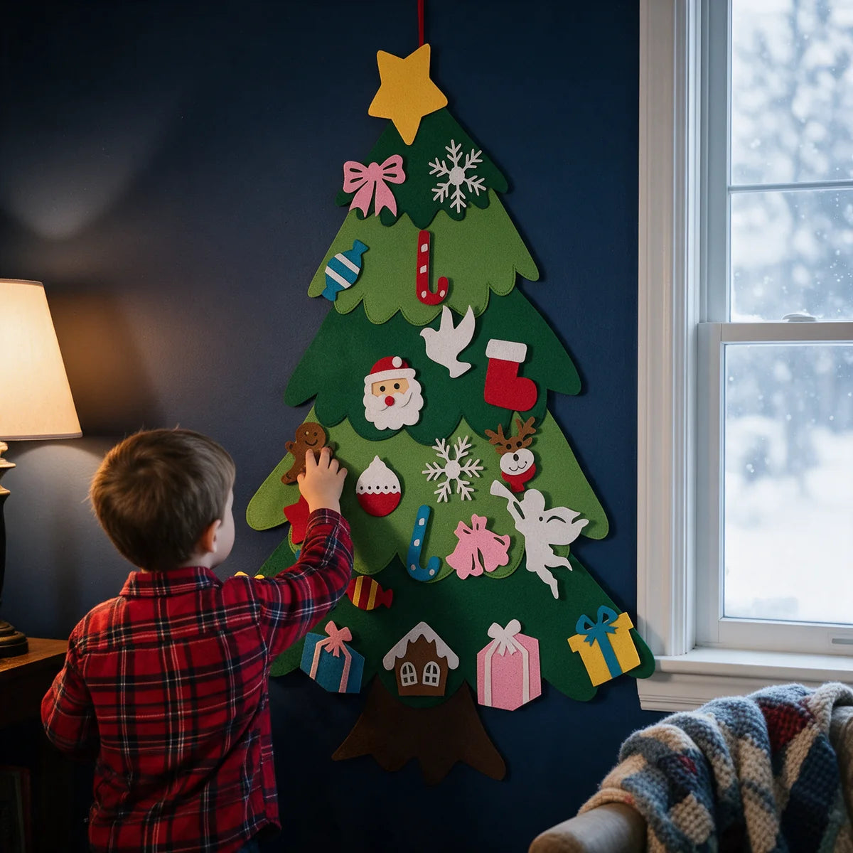 Felt Christmas tree on a blue wall, toddler adding a reindeer
