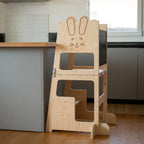 Montessori 3 in 1 learning tower held in an adult hand for scale