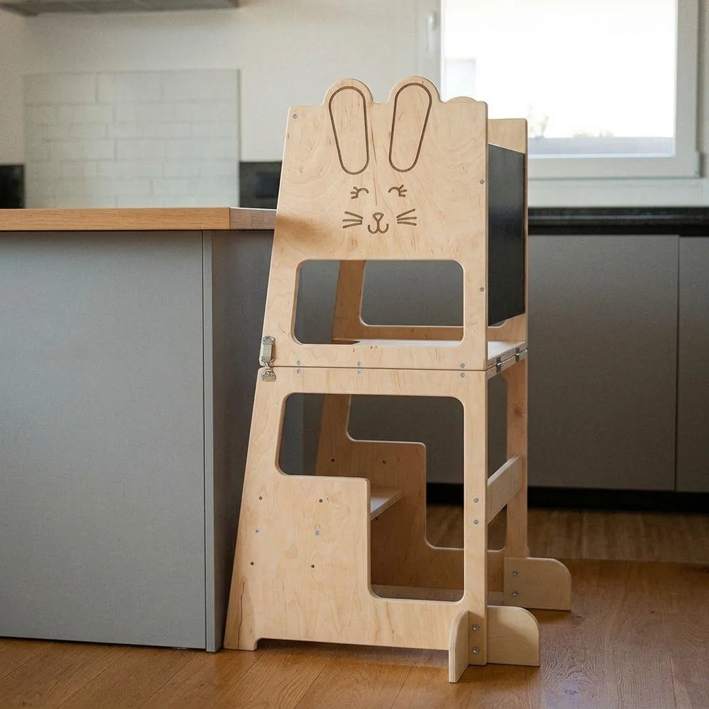 Montessori 3 in 1 learning tower held in an adult hand for scale