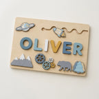 Wooden name puzzle board with rocket and mountain pieces
