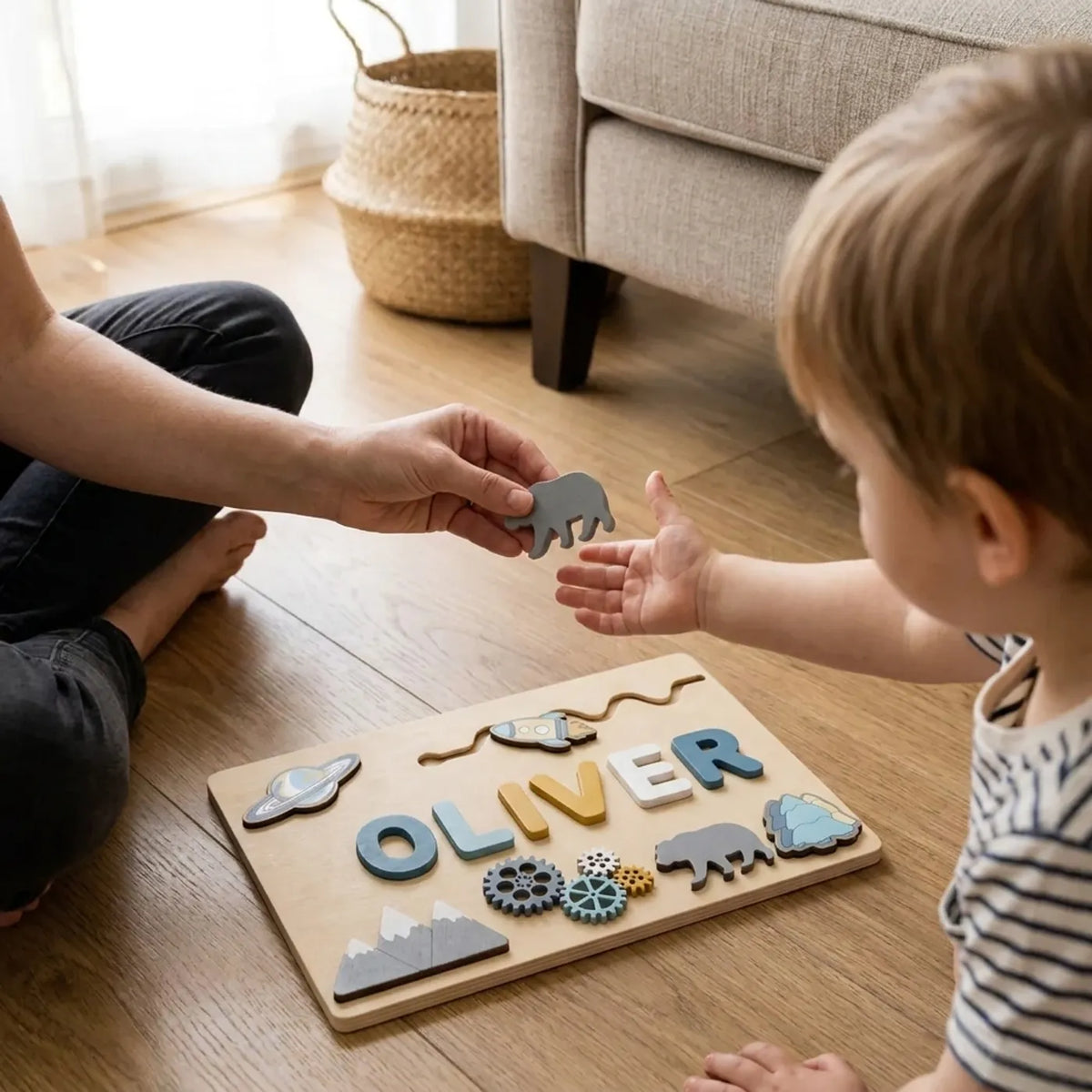 Parent handing a wooden bear piece to a small child