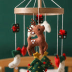 Close-up of the hand-stitched wool felt on the Reindeer & Trees crib mobile