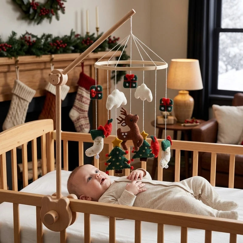 Baby lying in the crib looking up at the Reindeer & Trees felt mobile