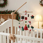Wooden baby crib mobile, Santa & Trees design, clamped on a crib rail in a christmas nursery