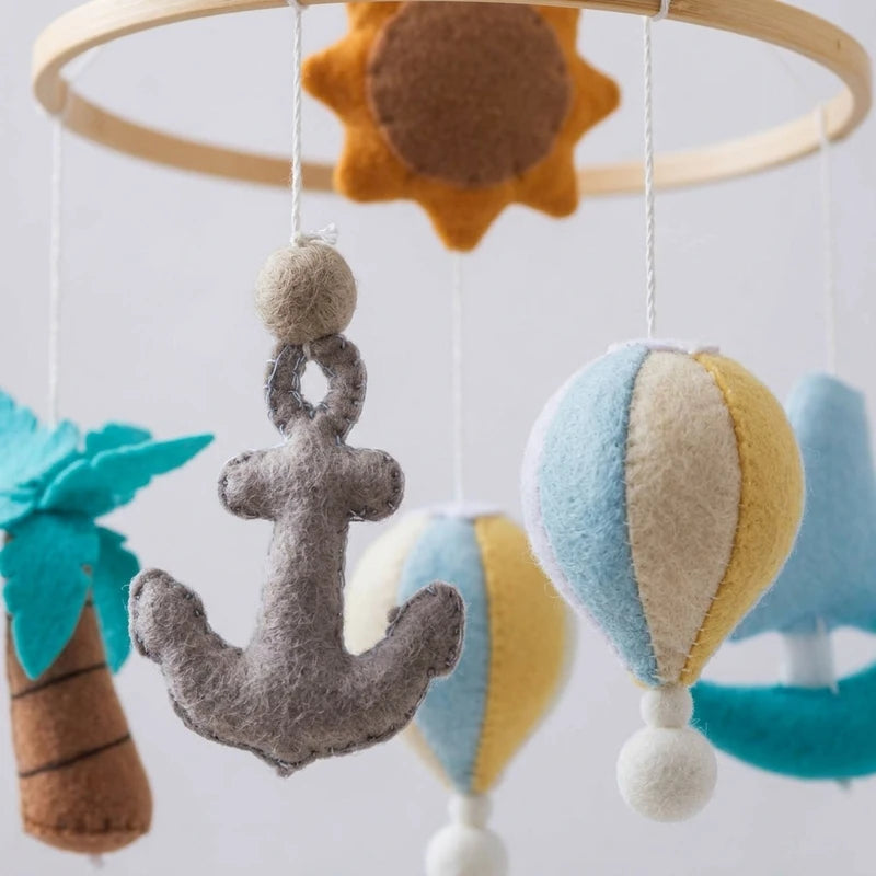 Close-up of the hand-stitched wool felt on the Seaside crib mobile