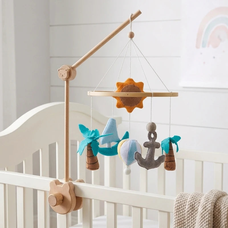 Wooden baby crib mobile, Seaside design, clamped on a crib rail in a ocean nursery
