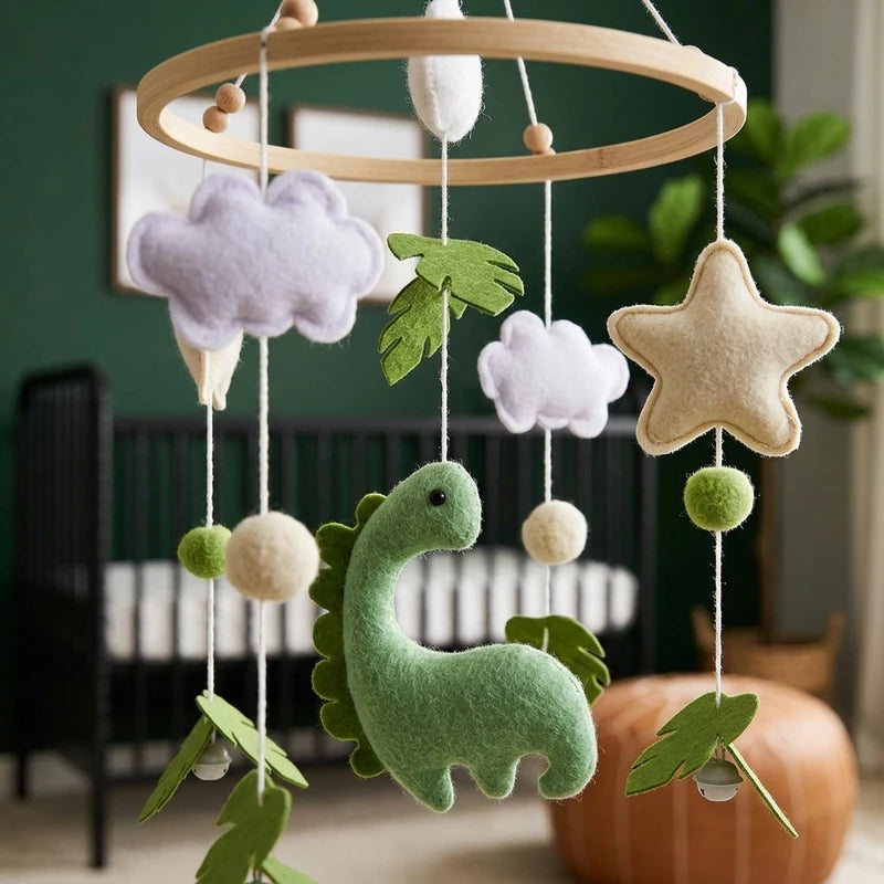 Close-up of the hand-stitched wool felt on the Green Dinosaur crib mobile