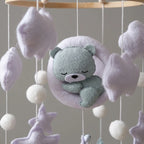 Close-up of the hand-stitched wool felt on the Lilac Moon Bear crib mobile