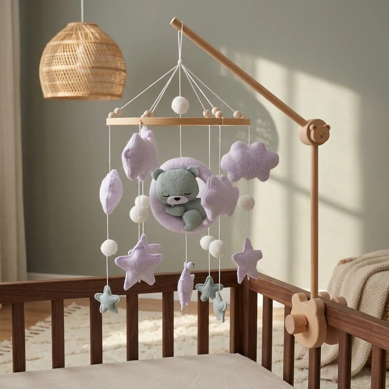 Wooden baby crib mobile, Lilac Moon Bear design, clamped on a crib rail in a sky nursery