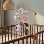 Wooden baby crib mobile, Pink Cloud Bear design, clamped on a crib rail in a sky nursery