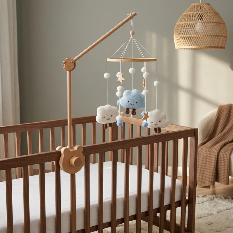 Wooden baby crib mobile, Smiling Clouds design, clamped on a crib rail in a sky nursery