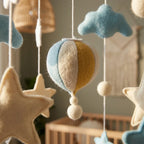 Close-up of the hand-stitched wool felt on the Sun & Hot Air Balloon crib mobile