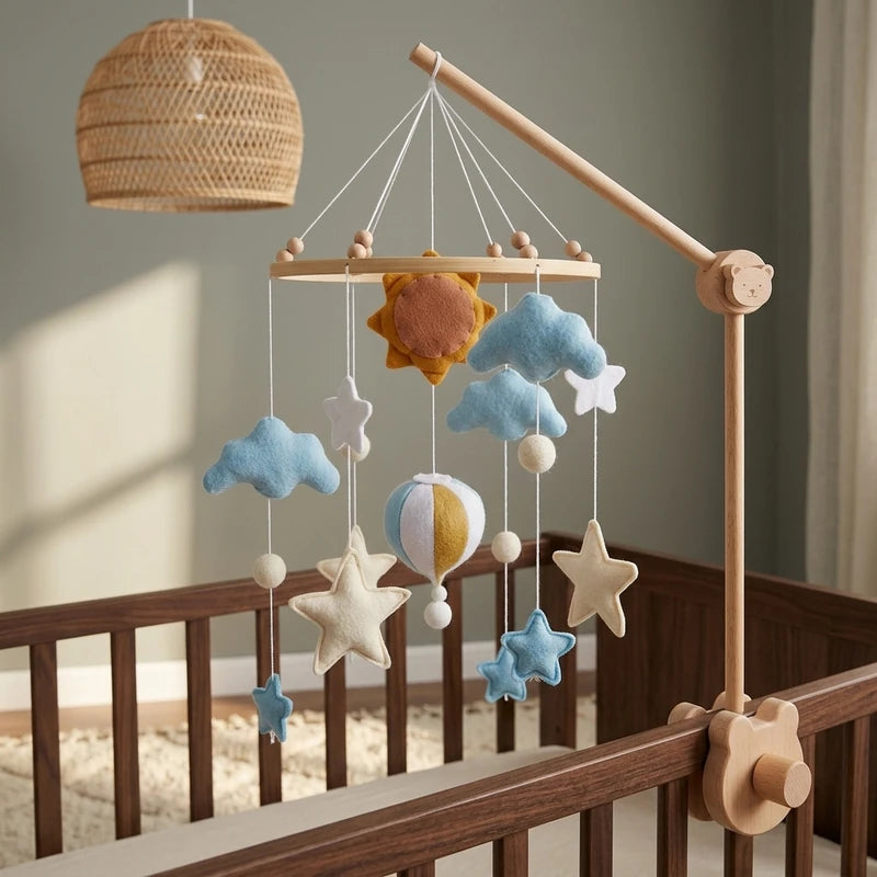 Wooden baby crib mobile, Sun & Hot Air Balloon design, clamped on a crib rail in a sky nursery