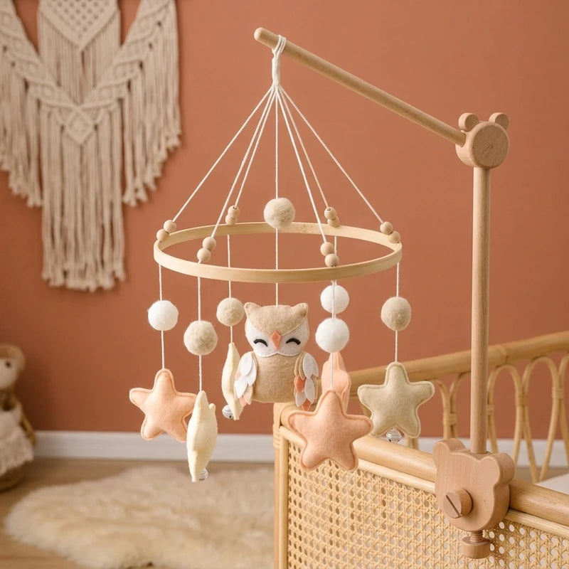 Wooden baby crib mobile, Beige Owl design, clamped on a crib rail in a woodland nursery